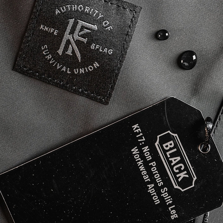 Knife & Flag Non-Porous Split Leg Apron — Black - Ultimate Tattoo SupplyKnife & Flag Non-Porous Split Leg Apron — Black