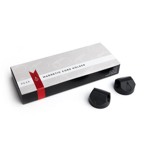 Box of Magnetic Cord Holders with two holders out of box on white background, full size