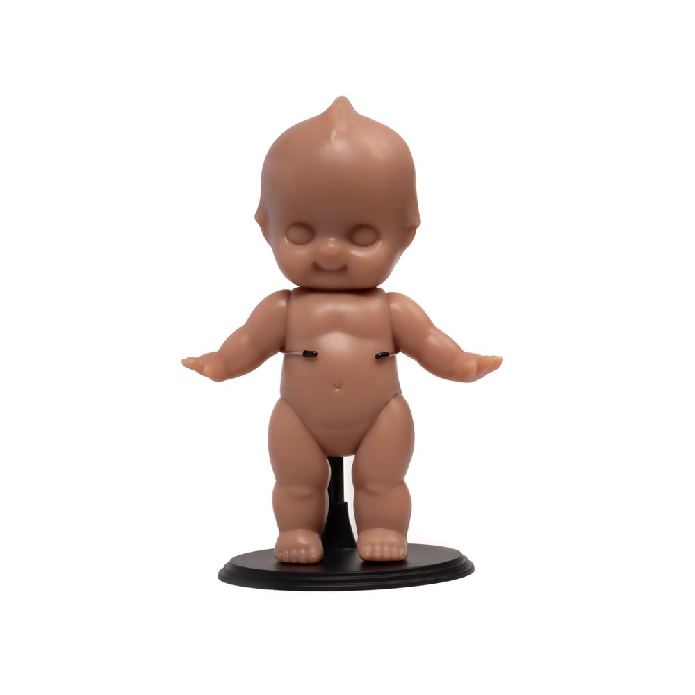 Light-Medium-toned tattooable cutie doll on a black stand with a white background.