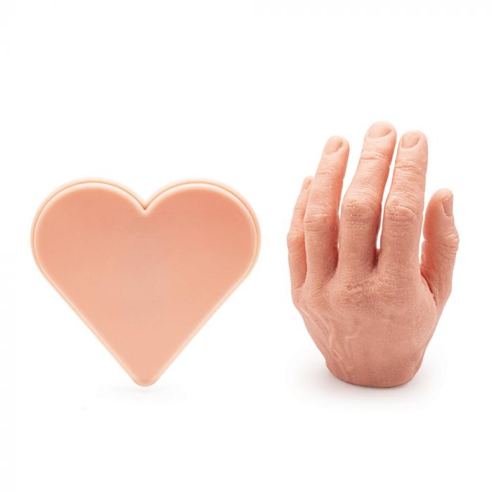 Light-toned tattooable flesh in the shape of a stylized heart next to a light-toned tattooable hand on a white background.