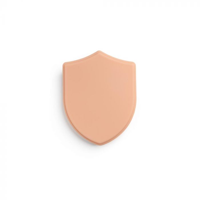 Light-toned tattooable flesh in the shape of a shield on a white background.
