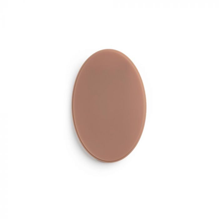 Medium-dark-toned oval of tattooable flesh on a white background.