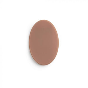 Medium-dark-toned oval of tattooable flesh on a white background.