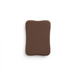 Dark-toned tattooable flesh in the shape of a square plaque on a white background.