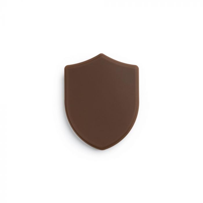 Dark-toned tattooable flesh in the shape of a shield on a white background.