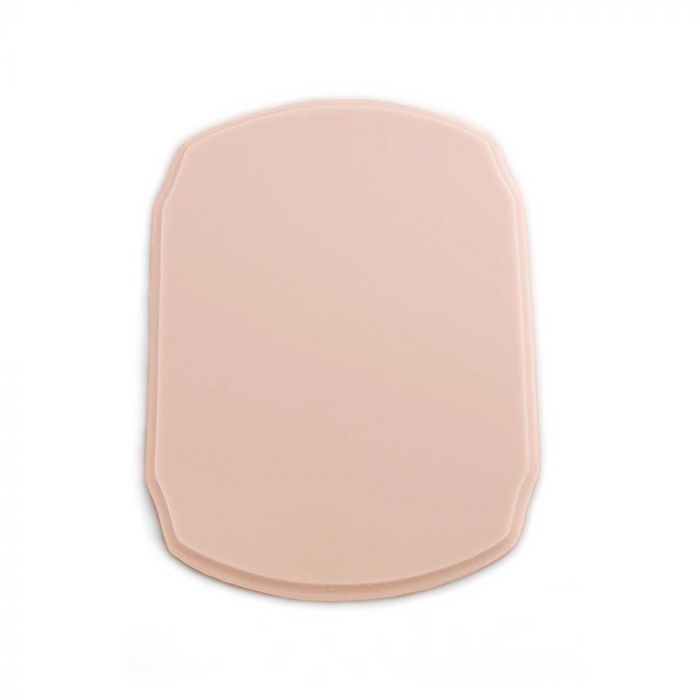 Pink-toned tattooable flesh in the shape of a rounded plaque on a white background.