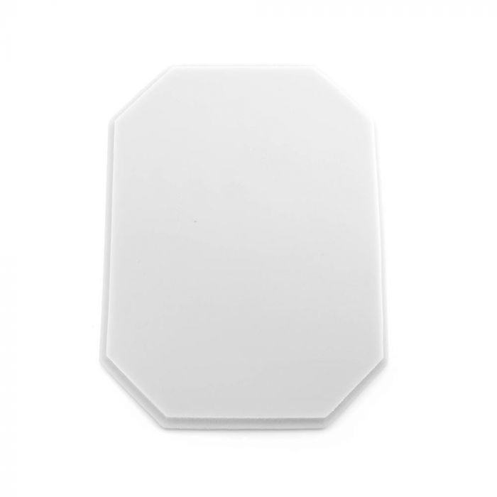 White tattooable flesh in the shape of an octagonal plaque on a white background.