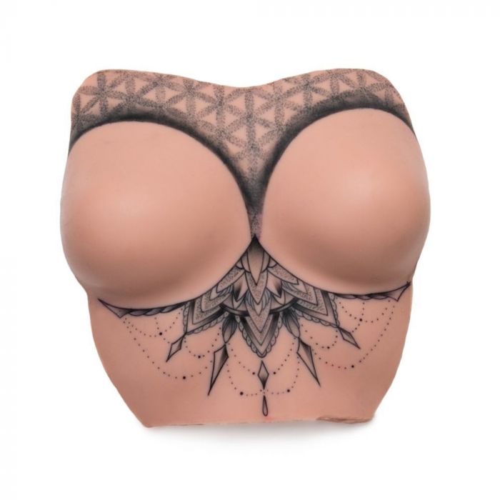 Light-toned tattooable flesh in the shape of female breasts with upper-torso, tattooed with a geometric pattern on a white background.