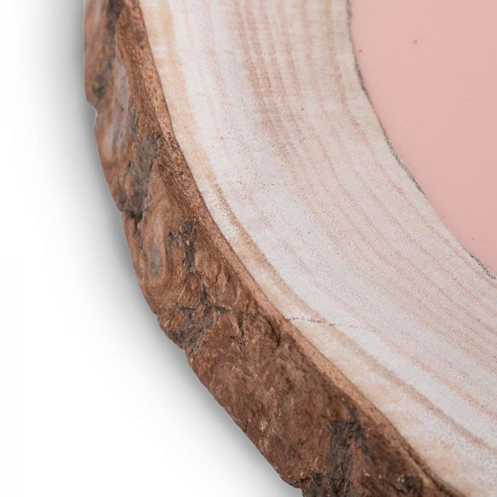 Close-up of tattooable flesh imbedded in a frame that looks like a wooden slab from the branch of a tree. This product is posed in front of a white background.
