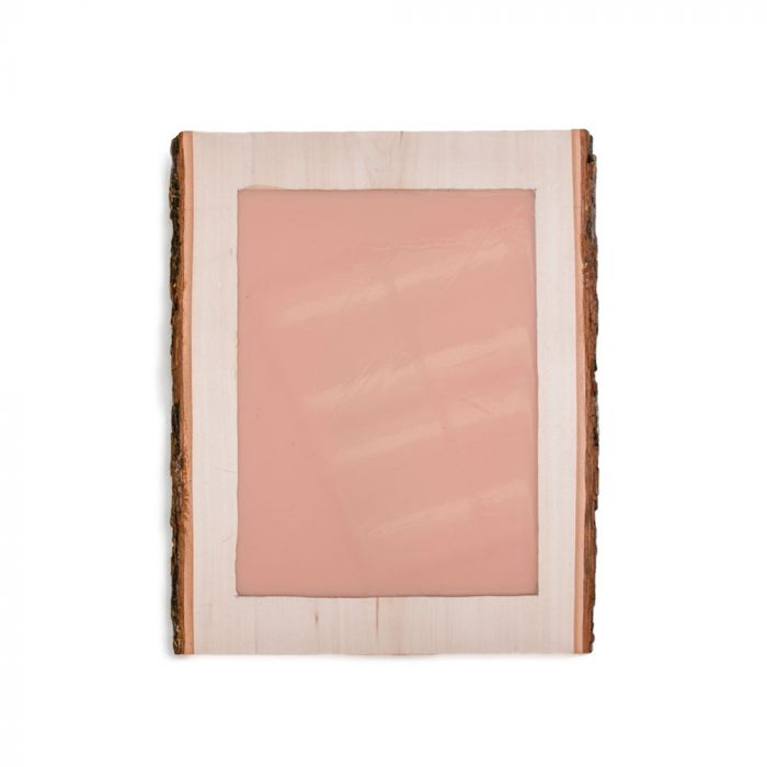 Light-skin-toned tattooable canvas imbedded in a rectangle slab of wood.