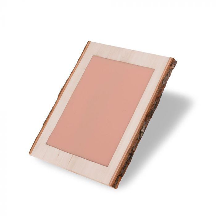 Light-skin-toned tattooable canvas imbedded in a rectangle slab of wood.